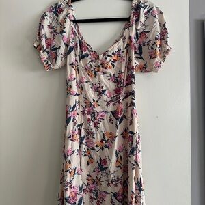 Roxy Pink and cream dress with a sweetheart neckline and puffy sleeves